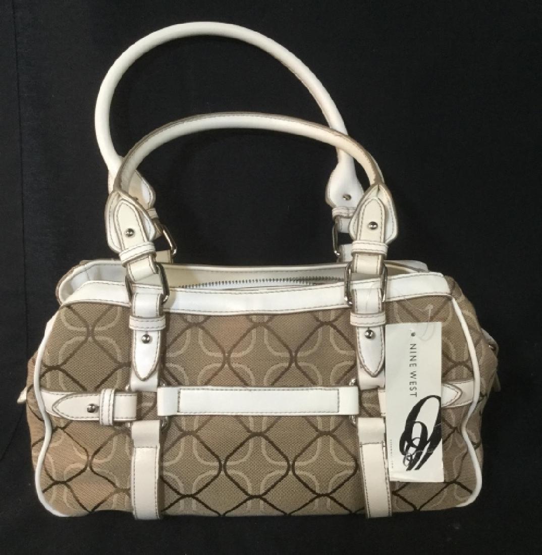 Nine West Ladies Purse: Never Used. Style is Element 9 Medium Satchel. Outside pocket, Two Snap Compartmentsgood condition, Tags Still Attached. Shoulder Bag, Handle approx 9 in diameter, 14 in Length, 7 in Height & Depth. L