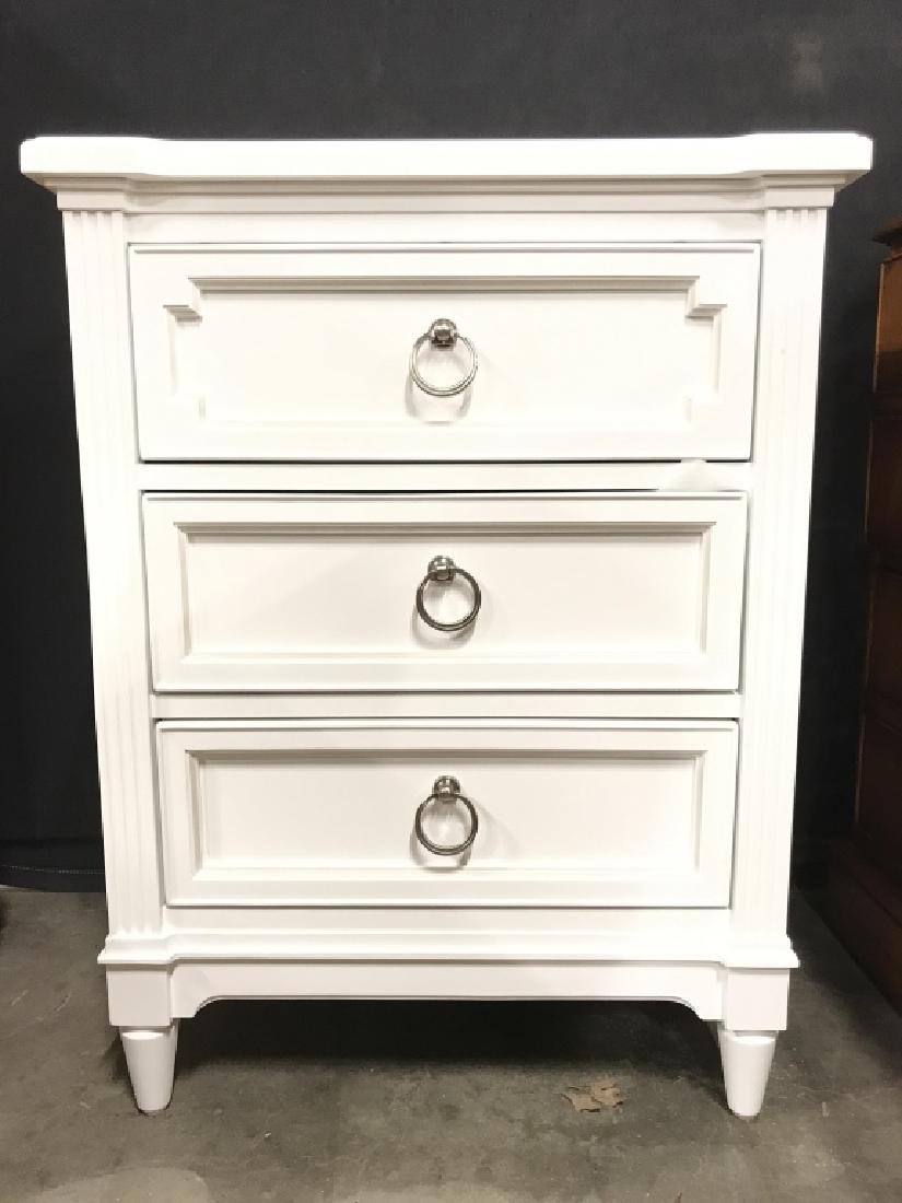STANLEY FURNITURE CO White Toned Nightstand: Backside has tag which reads STANLEY FURNITURE CO. Piece is white toned & contains 3 drawers each with silver toned metal loop style handles. Drawers appear to have hand dovetailing. Measures approx 3