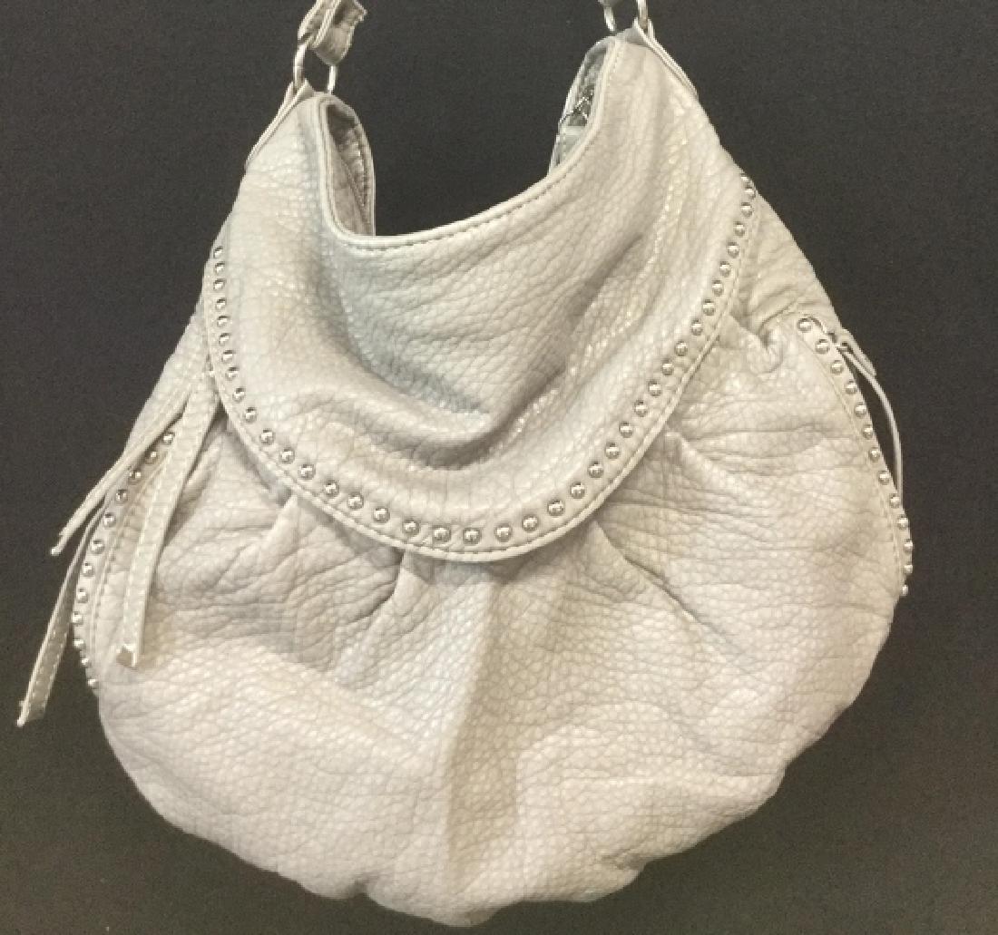 Red by Marc Ecko Faux Leather Handbag: Light Grey. Very Lightweight and very soft to touch. Red Polyester Lining. Very Clean inside and out. No Visible Discoloration. Zippers Open And Close with ease. Silver Toned Stud Tack Decor. Western