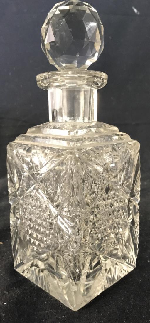Cut Crystal Decanter W Stopper: Decanter is cut crystal. Piece includes stopper. Measures approx 8.5 inches tall 3.5 inches square. Stopper has chips. Decanter, barware, tableware, tabletop accessory 6