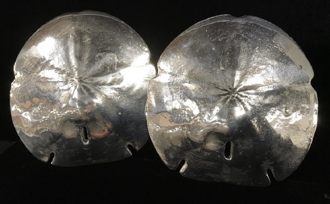 Pair Silver Toned Metal Sand Dollar Seashells: Pair Silver Toned Metal Sand Dollar Seashells From Lunares San Francisco, measures approximately 6 inches in diameter, no condition issues noted. Seashell Tabletop Decor, Beach House Decor, Vacation H