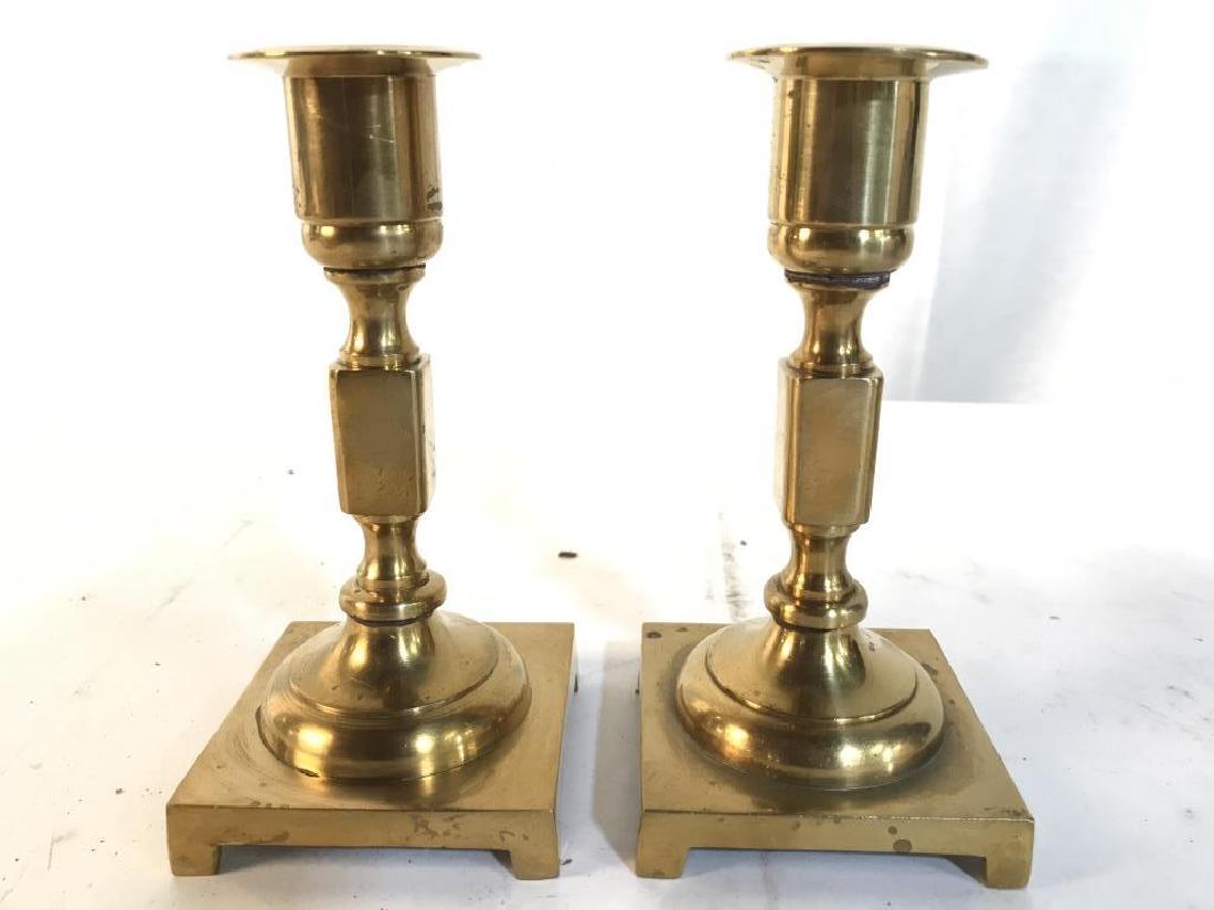 Pair Gold Toned Brass Candlesticks: Candlesticks are gold toned and brass. Each measures approx 5.25 inches tall, 2.5 inches square at base. tabletop accessory, home accessory, candleholders tableware, 6.