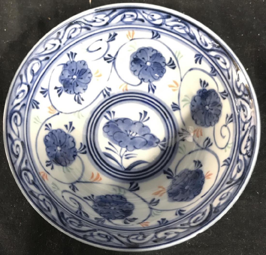 Set 3 Asian Porcelain Bowls: Underside of bowls have Asian characters on underside. Each have blue, green, and orange toned floral and leaf detail. Measures 6 inches wide 3 inches tall. Tableware, tbaletop accessories, asian arts