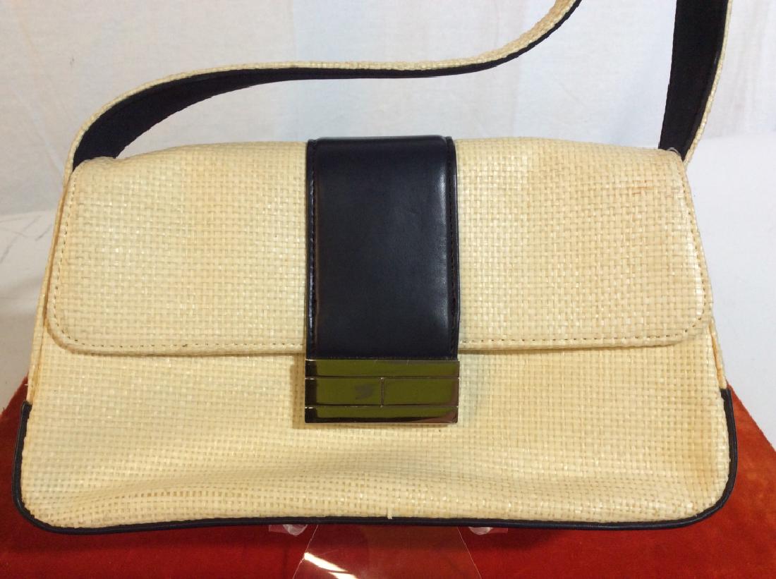 Tommy Hilfiger Straw Ladies Purse: Never Used. Tag Still on Purse. Possibly Some Discoloration on Exterior. Small interior zip pocket. Snap Closure. Back Pocket. Short Strap, approx 8 in. diameter. Bag Approx 9 1/4 x 5. Never Used Purs