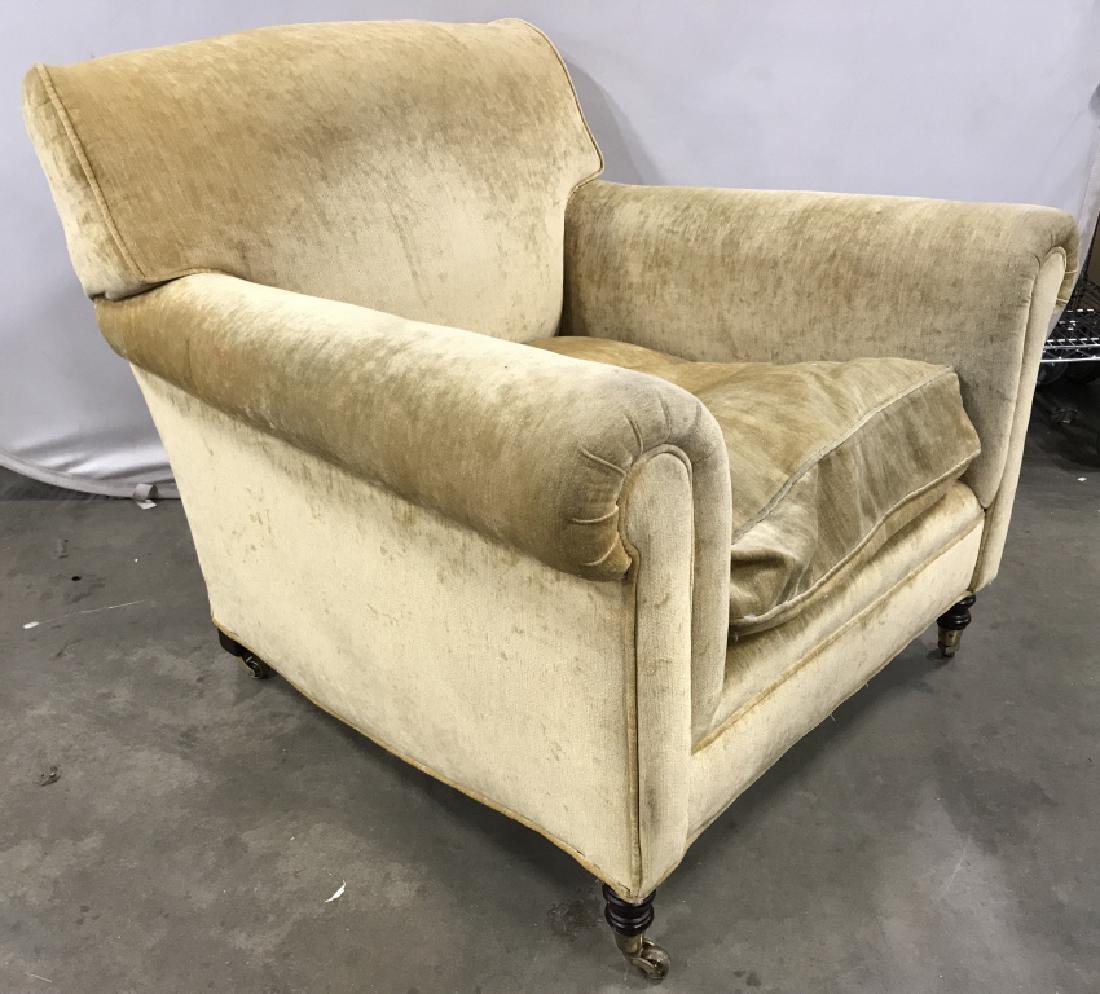 GEORGE SMITH Armchair On Casters: Armchair is GEORGE SMITH according to consigner. Piece is on Carved wooden & and gold toned metal casters. Contains wear, & some minor tears. Measures approx 33 inches tall 36 inches wide 39 inches de