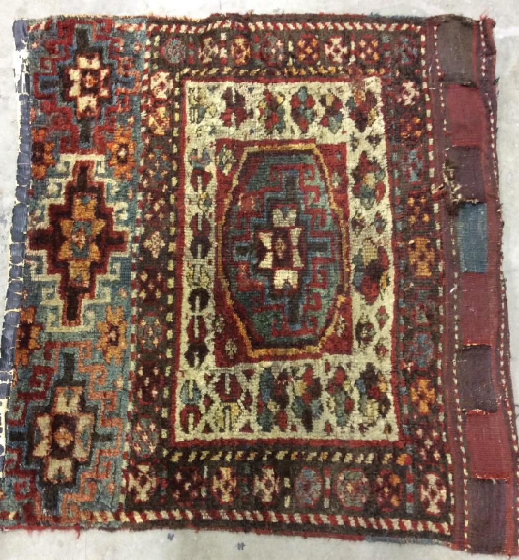 Vintage/Antique Handwoven Carpet: Vintage/Antique Handwoven Carpet Mat. Small area rug carpet, Handcrafted, floral design in tones of red, blue and orange. Some significant wear such as rips and tears. Measures approx 39 in by 34 in. 