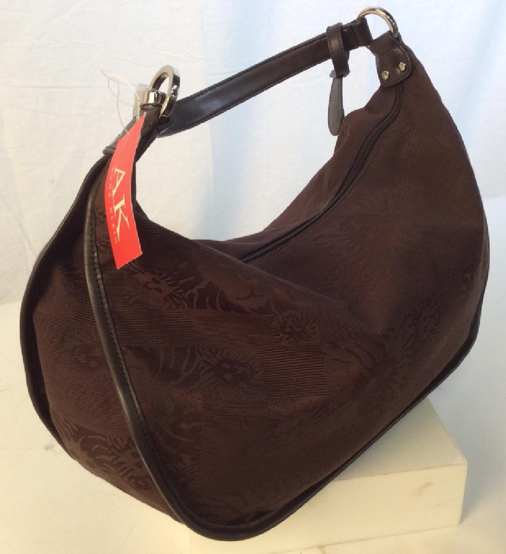 ANNE KLEIN Ladies Fabric Handbag: Never Used, with Tag. Style called Off the Hook Lion in color Java. Leather Strap w/ Silver Tone Hardware. Clean inside and out. No Marks on Bag, slight mark on strap hardware. Huge interior compartme