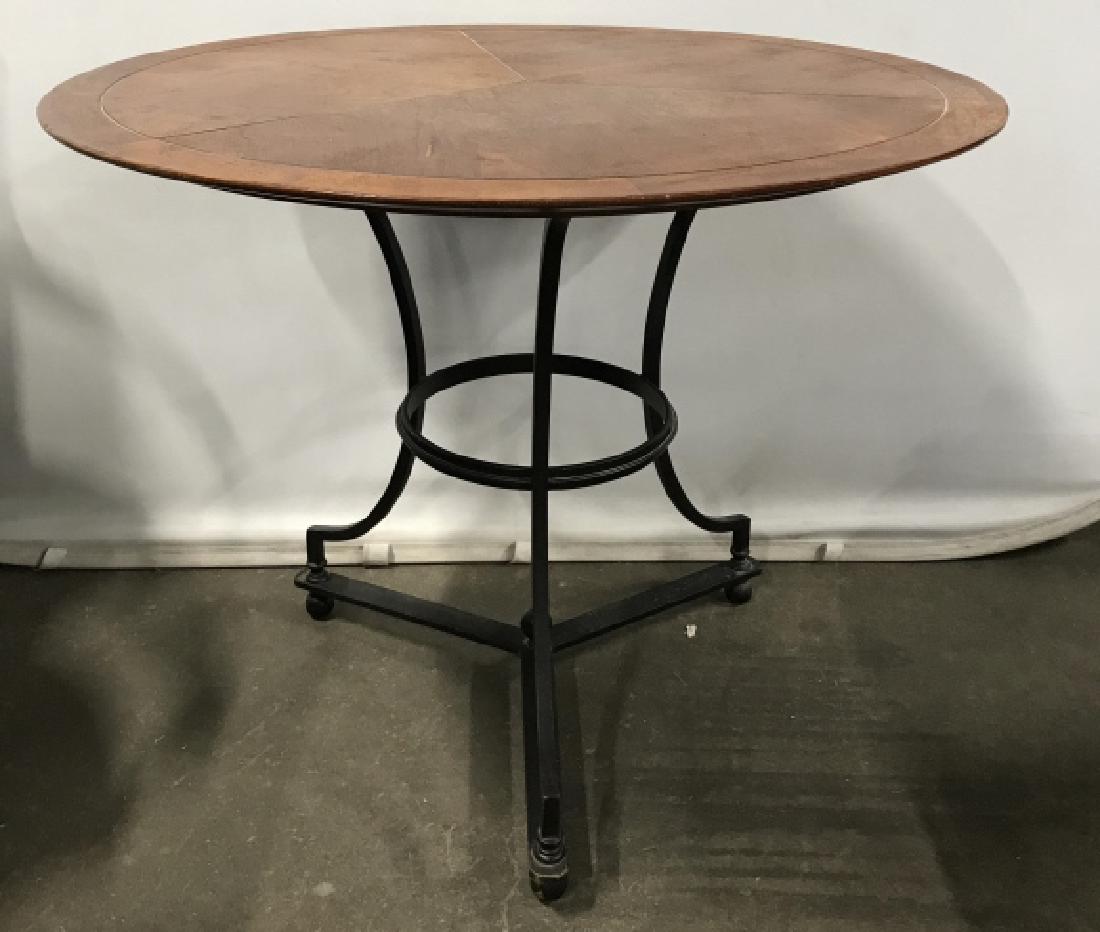 Circular Wooden Topped Table W Cast Iron Base: Circular Wooden Topped Table With Black Toned Cast Iron Base, Measures approx 34 inches in diameter x 29 inches tall, scratches and wear to top, top needs reattaching. Games Table, Side Table, End Tab
