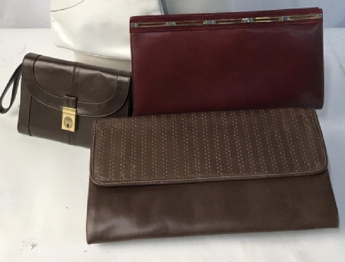 Lot 5 Vintage LUXURY FERRIGAMO/LOU TAYLOR Clutches: All Italian Leather or Suede. 1 White Ferragamo With Gold Tone Detachable Chain Shoulder Strap. Interior Black Leather. Snap Closure, 10 x 6.5. Chain 18 in. diameter. Needs Cleaning, surface wear from