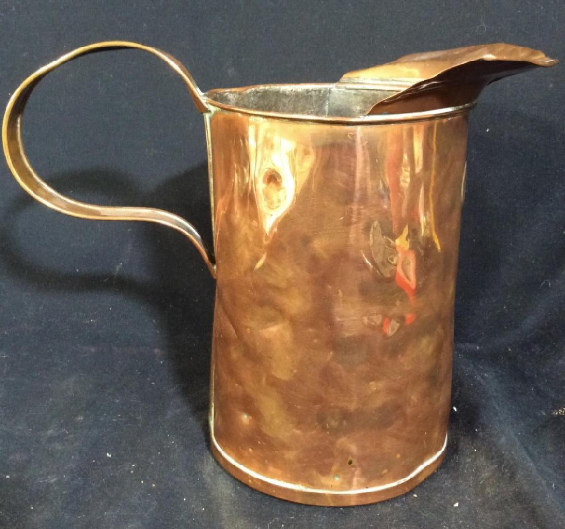 Vintage Copper Toned Half Gallon Pitcher: Piece appears to be copper. Underside is marked IS. MEASURES approx 8.5 inches tall 9 inches wide with handle & spout. Pitcher, water pitcher, home accessory, tabletop accessory, 6