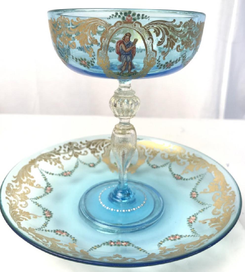 Lot 2 Venetian Hand Painted Glass Coupe And Plate: Lot 2 Vintage Possibly Antique Venetian Hand Painted Blue Glass Coupe with matching plate coaster, hand painted floral garlands and gold toned leaf and scroll border, gold fleck in clear stem and at b