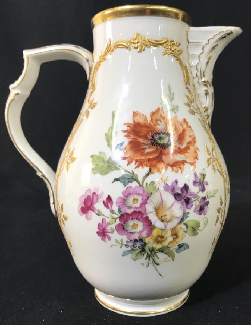 KPM Hand Painted Porcelain Pitcher: KPM Hand Painted Porcelain Pitcher With Multicolored floral design and raised gold toned painted scroll and vine accents, marked on underside KPM Made In Germany in red lettering and blue toned staff