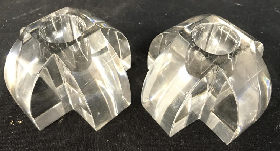 Pair BACCARAT Cut Crystal Candlesticks: Underside of each piece reads BACCARAT FRANCE on underside. Each measures approx 3.5 inches wide 2.25 inches tall. One piece has small chip. Home accent, tableware decorative accessories, mantle piece