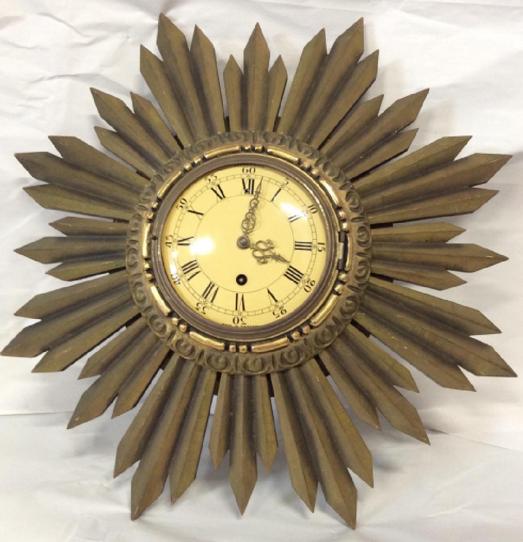 WESTERSTRAND Sunburst Wall Clock, Sweden: Clock is two pieces, Center clock face, appears to be metal with filigree design hands, marked WESTERSTRAND and Made In Sweden, clock body with wood and possibly gesso areas, separate wood sunburst fr