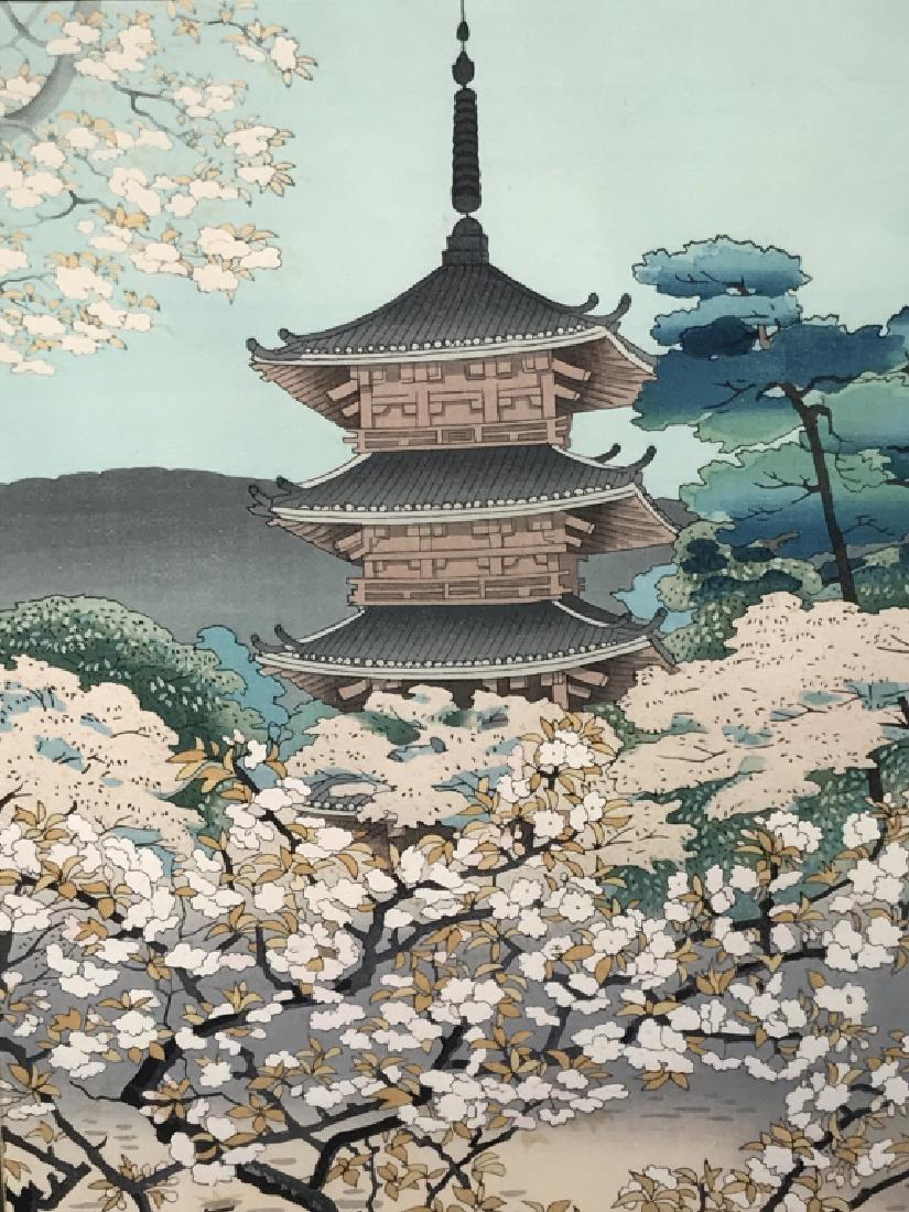 Signed Ukiyo-e Japanese Wood-block Print: Signed Ukiyo-e Japanese wood-block Print depicts a building among trees in bloom. Signed in Japanese characters in lower left corner. Print is double matted and set behind glass in wood frame stylized