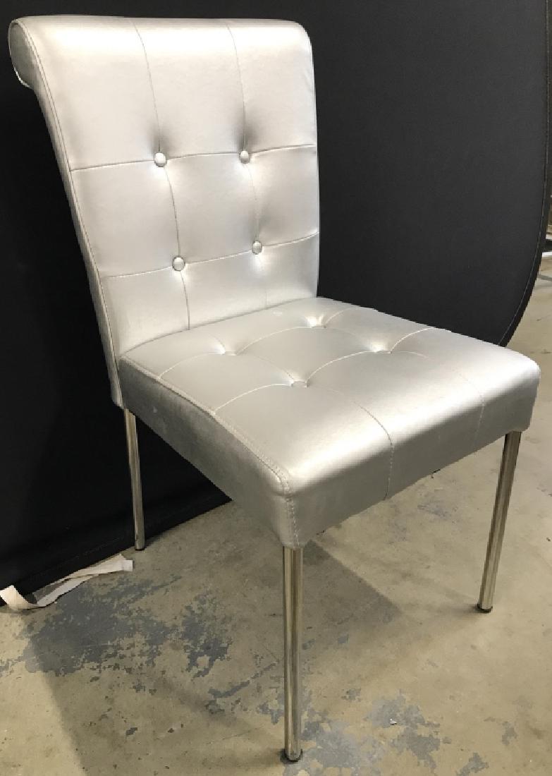 Silver Toned Tufted Side Chair: Chair is silver toned & and Tufted. Contains 4 silver toned chrome style metal legs. Piece measures approx 36 inches tall 18 inches wide 23 inches deep. dinner chair, hall chair, home accent, home fur