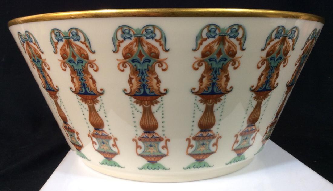 Vintage LENOX Bone China Serving Bowl: Gold toned trim, possibly 24 K Gold, Very Good Condition, w/ urns column with leafy vine exterior pattern and sun motif with faces, 10.25 in. diameter. 4.5 in. height. Stamp Marked On underside. Lenox