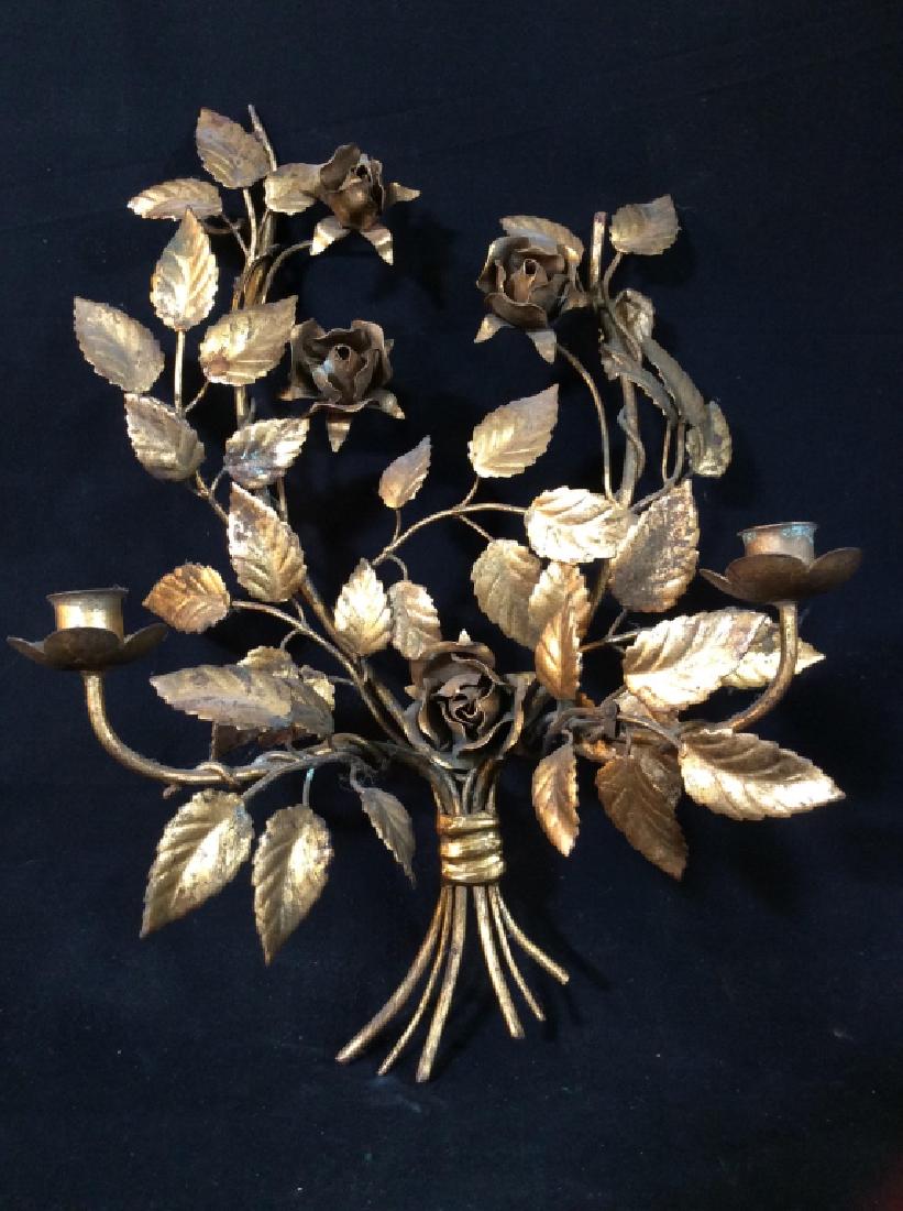 Pair Gilt Metal Floral Bouquet Candelabra: Pair of gilt metal 2-arm candelabra stylized as floral bouquets. Candelabra are Wall Hanging Sconces. Each measures approx 20 inches in height by 14 inches in width by 7 inches in depth. Some surface 