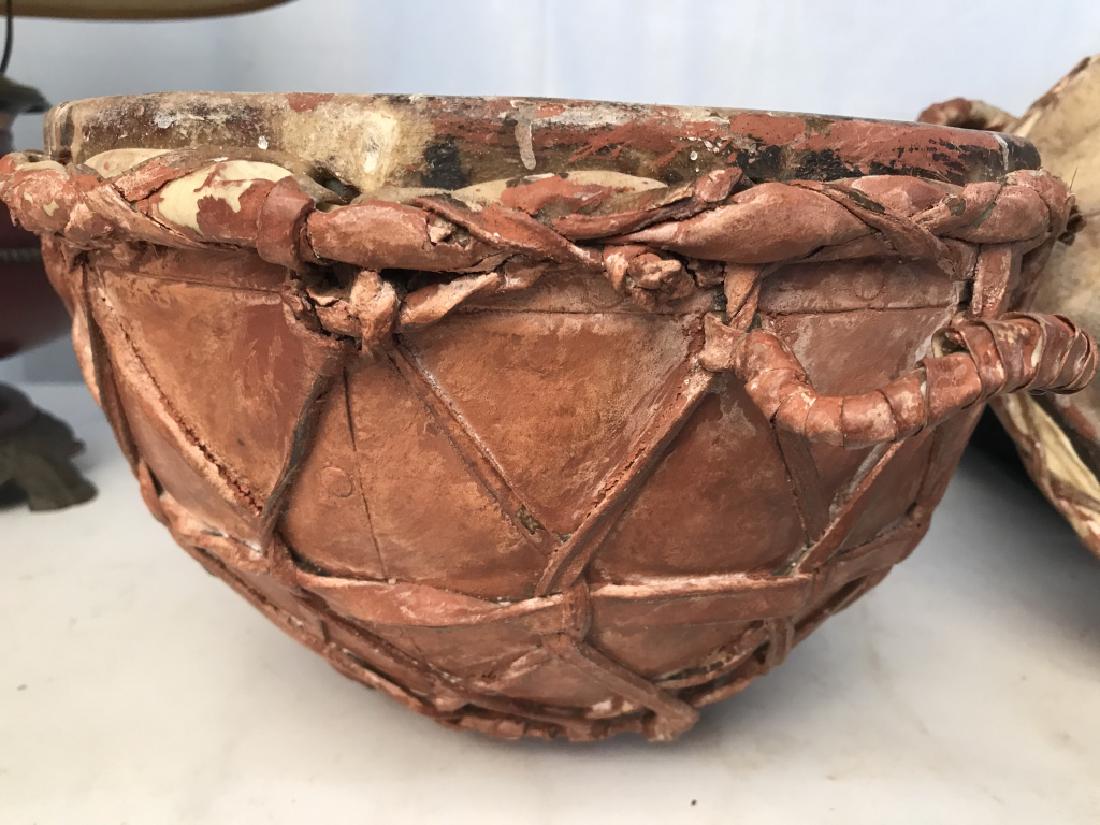 Vintage Handmade Native Bongo Ceramic Drum Set: Base of drum made of ceramic. Woven basket possibly made with some other type of animal part, or leather. Top of drum as well. Braided to hold the ceramic in and made with carry handles. Does not smel