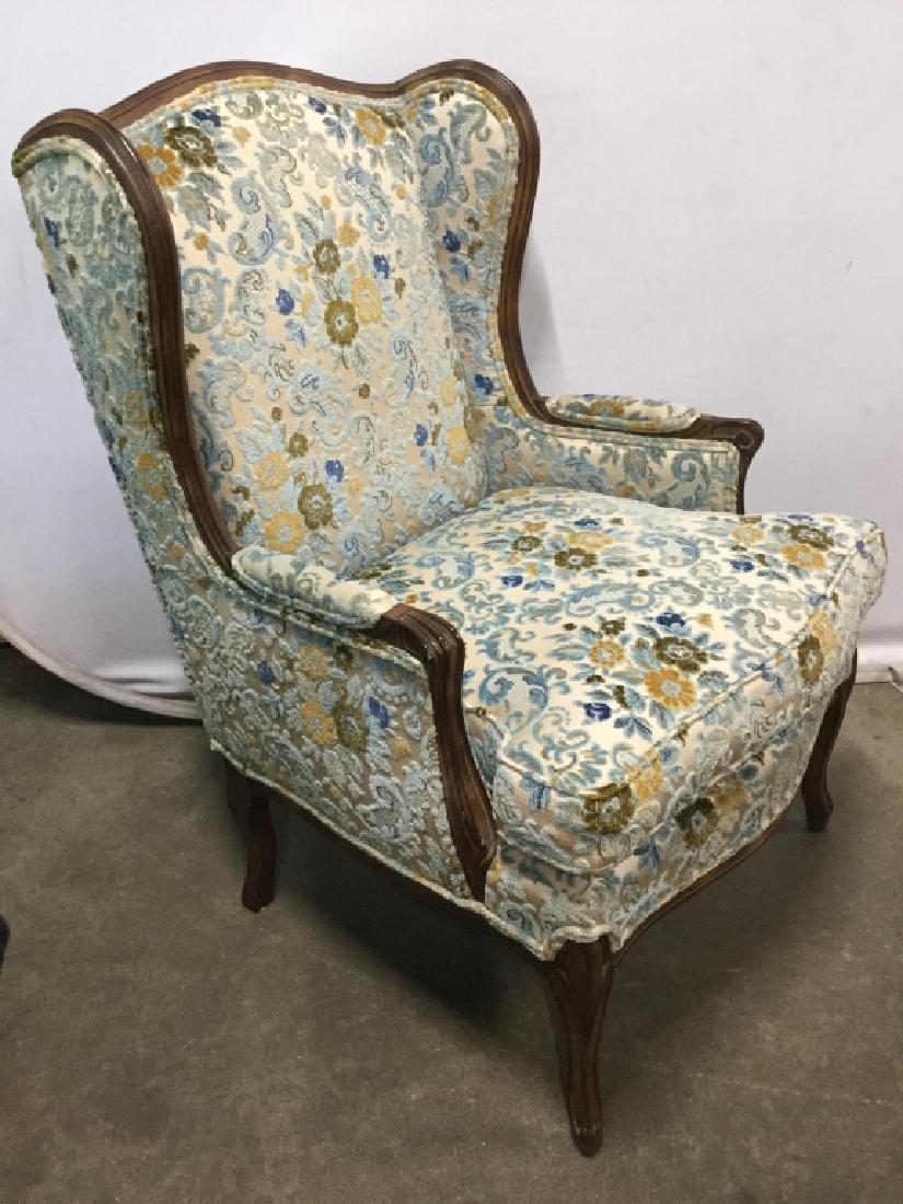 SERJE FURNITURE Wingback Chair & Footrest: Tag underneath cushion reads SERJE FURNITURE. Chair is Upholstered with teal, brown, blue, and beige. Chairs has winged backrest. Lot also includes matching foot rest. Chair measures approx 40 inches