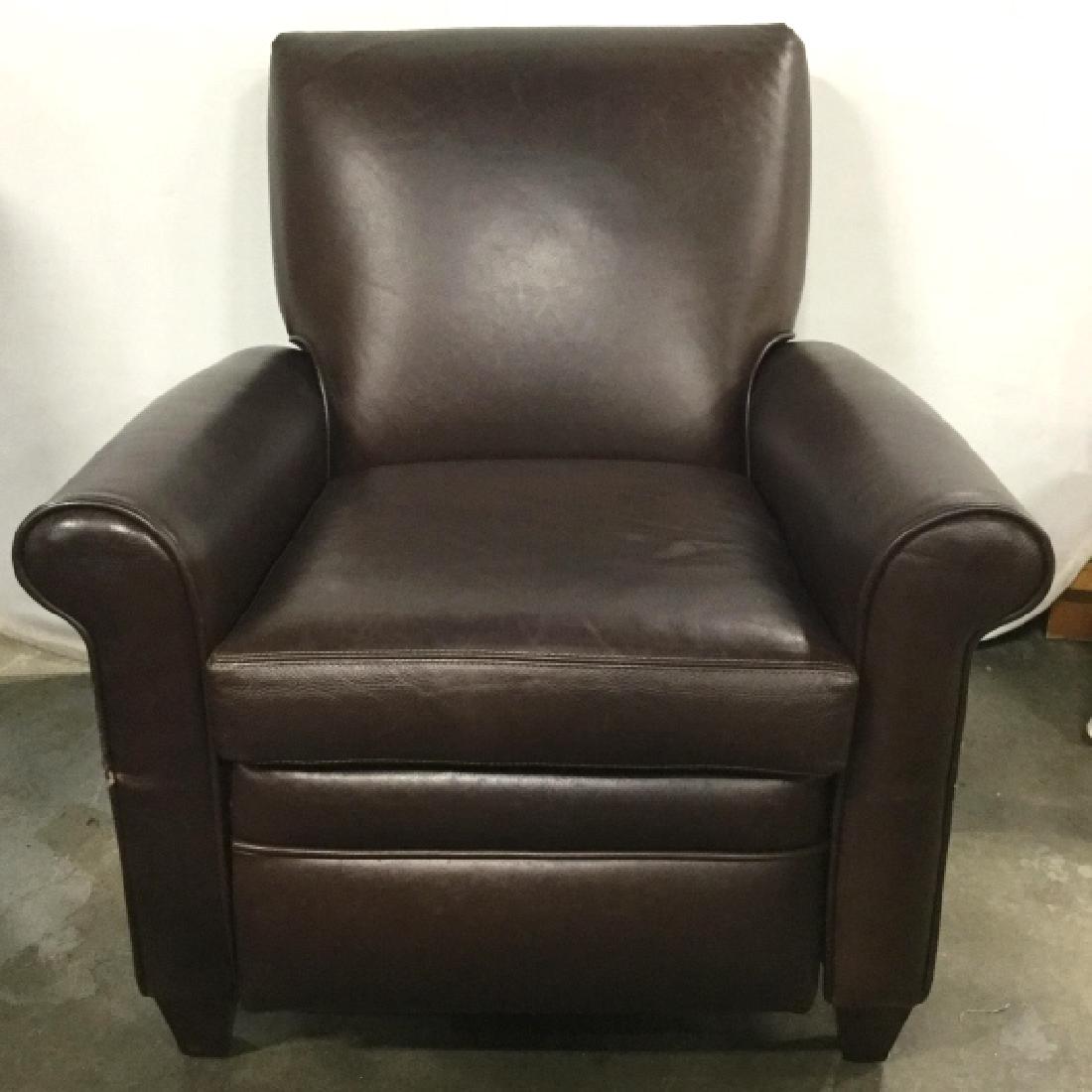 BARCA LOUNGER Brown Toned Leather Recliner: Tag underneath cushion reads BARCA LOUNGER. Piece is brown toned and appears to be genuine leather. Contains some minor wear. Piece measures approx 35 inches tall and deep 31 inches wide. Leather upho