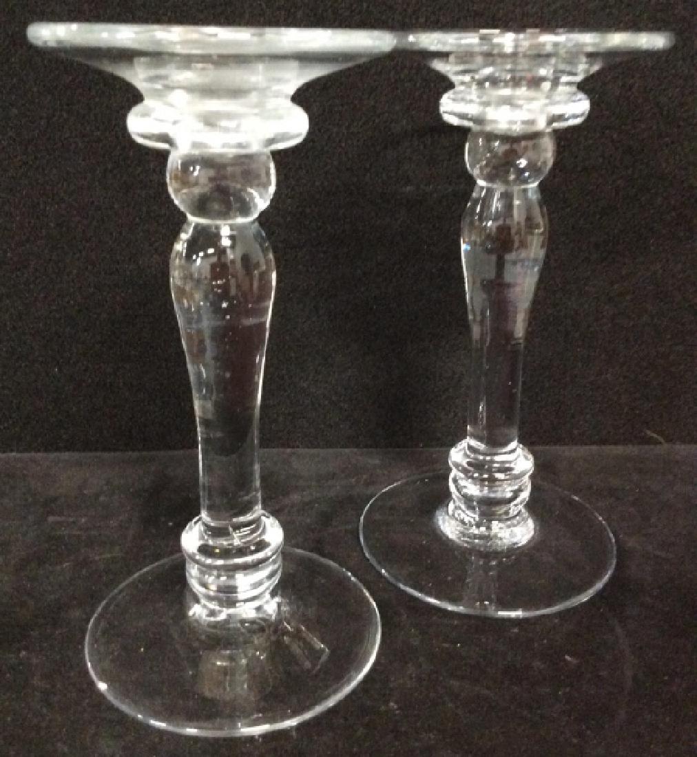 Pair Art Glass Candlesticks: Clear toned art glass, pair candleholders, tableware, table top of decor, home accent. Measures approx 9 in by 4 1/2 in. 4