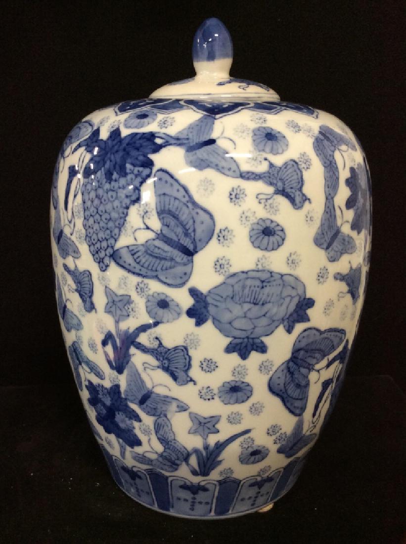 Large Asian Porcelain vase: grey/white toned glaze finish with blue toned butterfly and flowers design. Some minor surface wear and imperfections. Marked on underside with Asian characters, Measures approx 12 in by 8 in, asian a