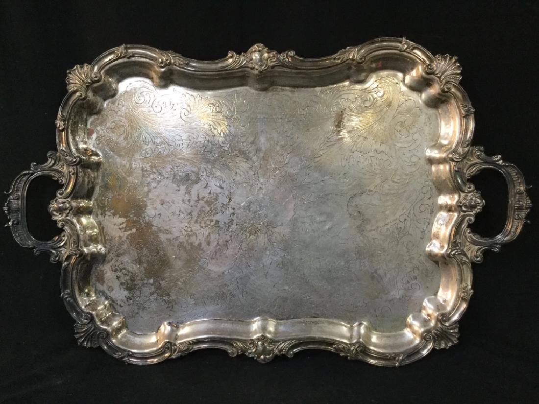 Silver Plated SHEFFIELD England Serving Tray: Underside is marked SHEFFIELD ENGLAND. Piece is ornately Detailed. Contains 4 feet. Piece measures approx 32 inches long, 20 inches deep. platter, serving tray, centerpiece, tableware, 6