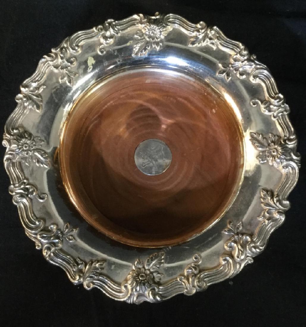 ISF LTD Silver Toned Wine Bottle Coasters: possibly silver plate. Center appears to be wooden. Edges of pieces are Ornately Detailed w floral detail. Each measures approx 8 inches wide, 1.75 inches tall. Tableware, coasters, wine holders, deco