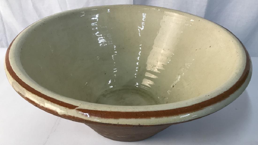 French Provincial Centerpiece Glazed Antique Bowl: Old World Pottery. Interior And Rim Glazed. Handmade. Wide V- Shape Vessel. Approx 7.5 in. tall, 16.5 in. wide. Cracked glaze due to age and use. No other noted conditions. Antique Wash Basin, Pottery