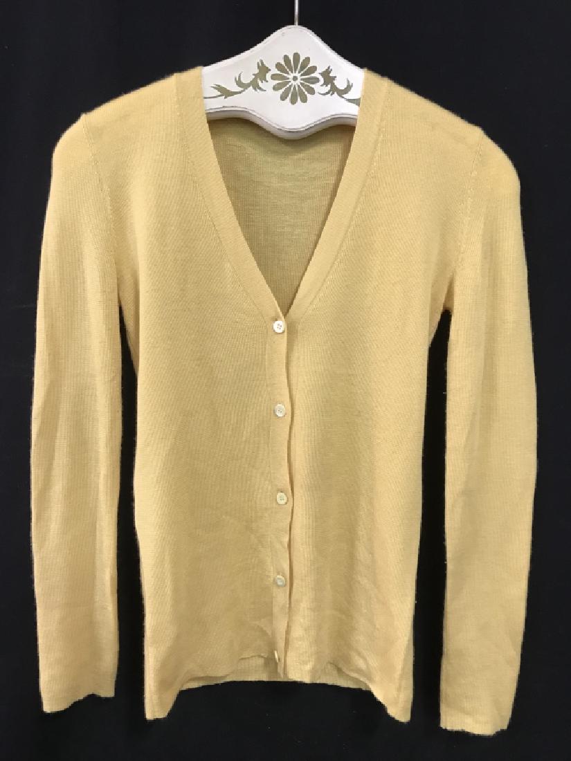 PRADA Luxury Designer Cashmere Silk Blend Cardigan: Label reads for PRADA, Made In Italy, Size 42, 70% cashmere, 30% silk. Button down cardigan is buttercup yellow in tone. Some minor pilling, might need spot cleaning. PRADA Luxury Designer Clothing, D
