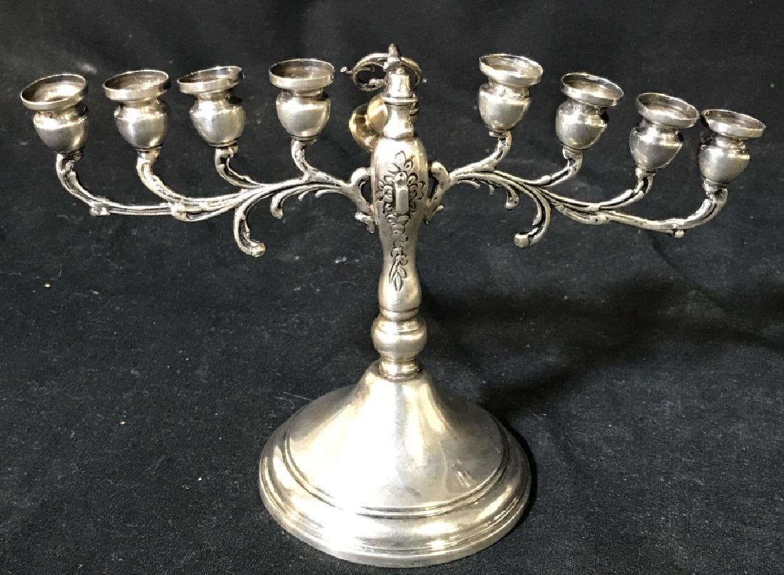 Vintage STERLING SILVER Menorah: Marked Sterling. Small Menorah. Base approx 4 in. Spreads out to approx 8 in. center candle is broken off from body, requires repair. Hallmarked Sterling, Judaica, Chanukah, Sterling Menorah, Estate S