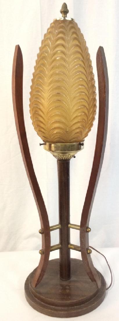 Mid Century Modern Lamp: Lamp has gold toned glass globe. Piece has 3 s curve wooden structures around globe. Base is circular & wooden. Mid Century Modern Lamp, Mid Century Modern, Mid Century Modern Lighting, Table Lamp, Ar