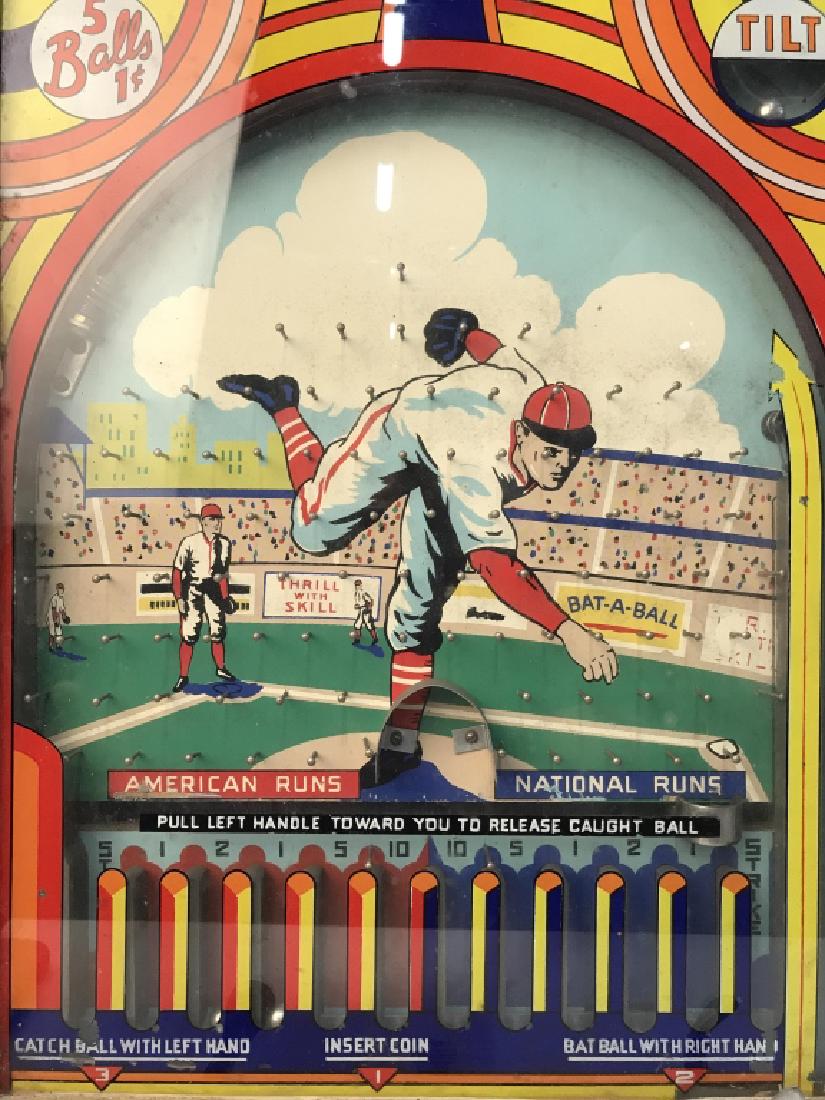 Vintage DEL MUSIC CO Plinko Style Baseball Game: Backside has tag which reads DEL MUSIC CO. Piece is vintage. Outer frame is wooden. Lower right side contains launch handle, center contains coin slot, and left contains crank. Contains image of a bas