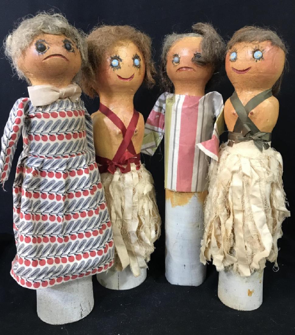 Lot 4 Vintage Folk Art Painted Dolls On Round Logs: Lot 4 Vintage folk art dolls, three female and one male, painted over round wooden pegs, each wearing mixed fabric clothing and wigs. Possibly white birch logs. C. 1940s, New Hampshire. Each measures 