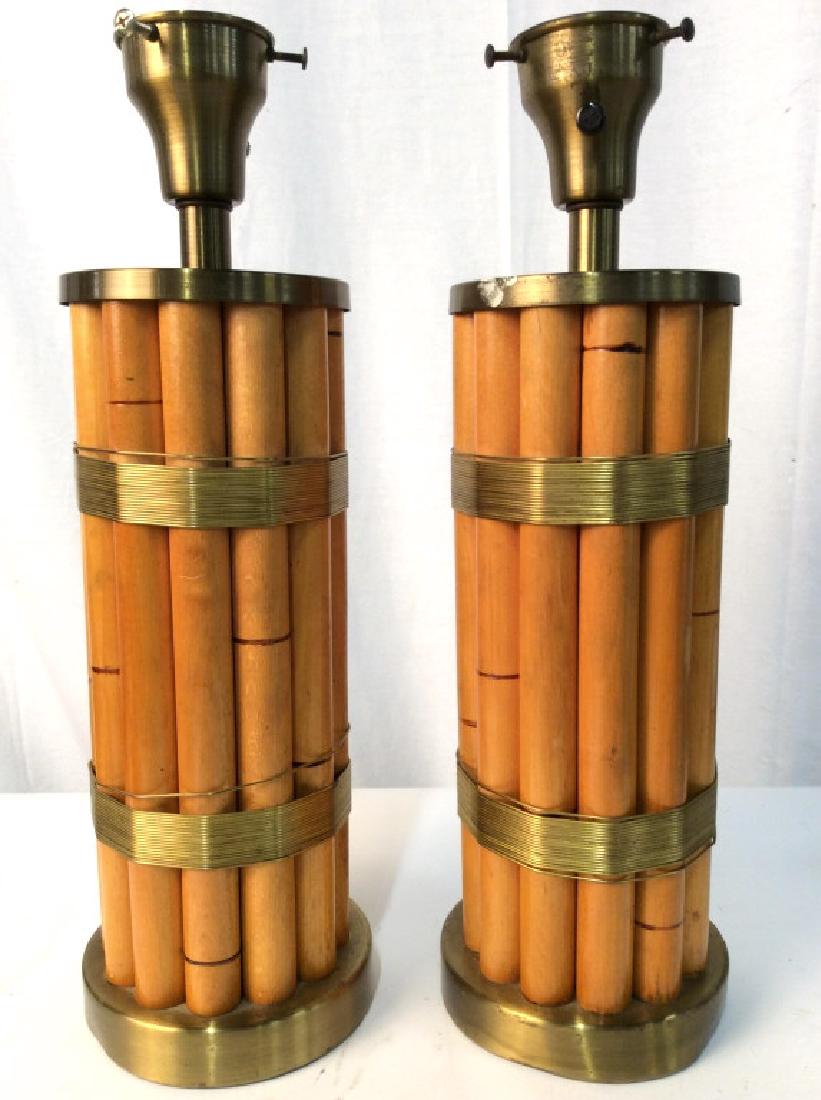 Pair Bamboo Style Lamps: Lamps have gold toned bases and bulb sockets which appear to be brass. Lamp body has bamboo style. Measures approx 18 inches tall 6 inches wide. home lighting, home accessory, home decor, tabletop lam