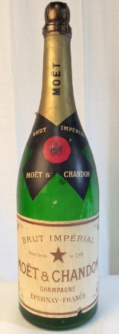 Oversized MOET & CHARDONNAY Prop Bottle: Label on piece reads MOET & CHARDONNAY CHAMPAGNE EPERNAY FRANCE. Piece appears to be vintage. Glass is green toned. Measures approx 32 inches tall 9 inches wide. Contains evident wear. Home accent, ho