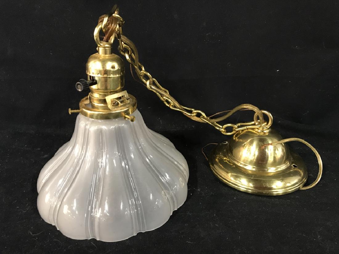 REJUVENATION Glass Drop Pendant Light Fixture: Frosted glass pendant with brass chain and hardware. Pendant measures approx 7.5 inches in height by 7 inches in diameter. Chain measures approx 17 inches in length including end. Marked for REJUVENAT