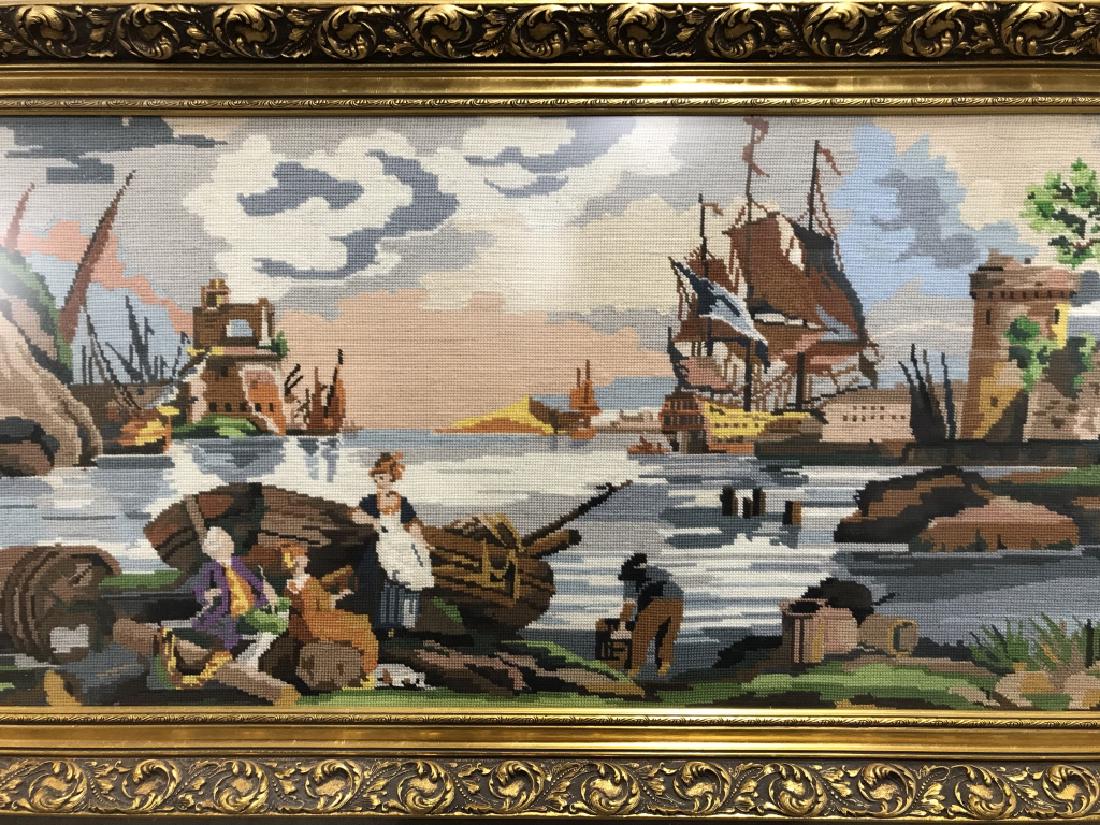 Vintage Maritime Needlepoint Artwork: Needlepoint artwork depicts maritime theme with ships and figures in colonial clothing. Needlepoint art is set behind matte glass and set in tone wood frame. Measures approx 25.25 inches in height by 