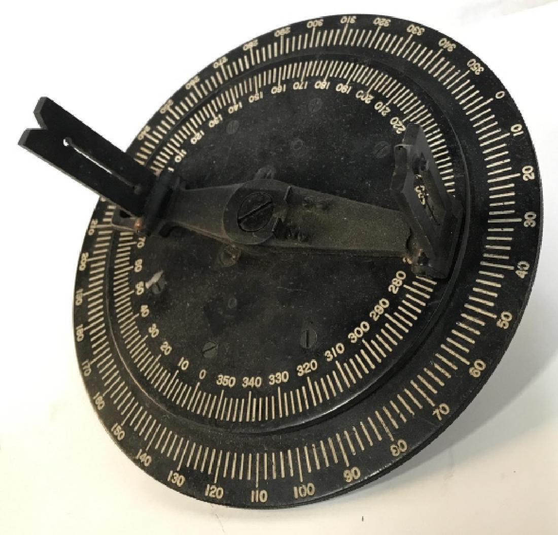 Vintage Metal Surveyors Compass: Metal Possibly Iron surveyors instrument, tiered discs sighting, numbered , and hinged reticulating parts, measures diameter app 9 inches, sighting piece height app 5 inches, surveyors Equipment, mech