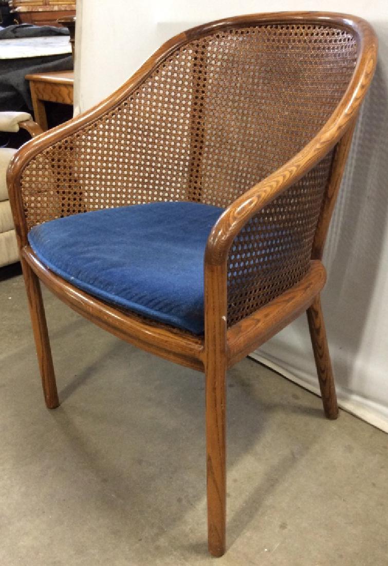 BRICKEL ASSOC. INK Caned Wooden Chair: Chair is Caned. Piece is possibly vintage. Contains blue toned cushion. Tag reads BRICKEL ASSOC INC. Piece measures approx 33 inches tall 24 INCHES DEEP 23 inches wide. Home furnishigns, home accessor