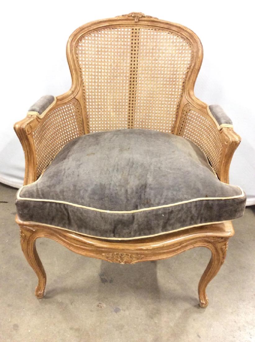 Pair Vintage Carved Wooden Caned Bergeres: Bergere is Caned, Contains Carved Wooden Detail. Piece is vintage. Includes loose grey toned cushion and 2 Cushioned armrests. Piece measures approx 36 inches tall 26 inches wide 28 inches deep. Cushi