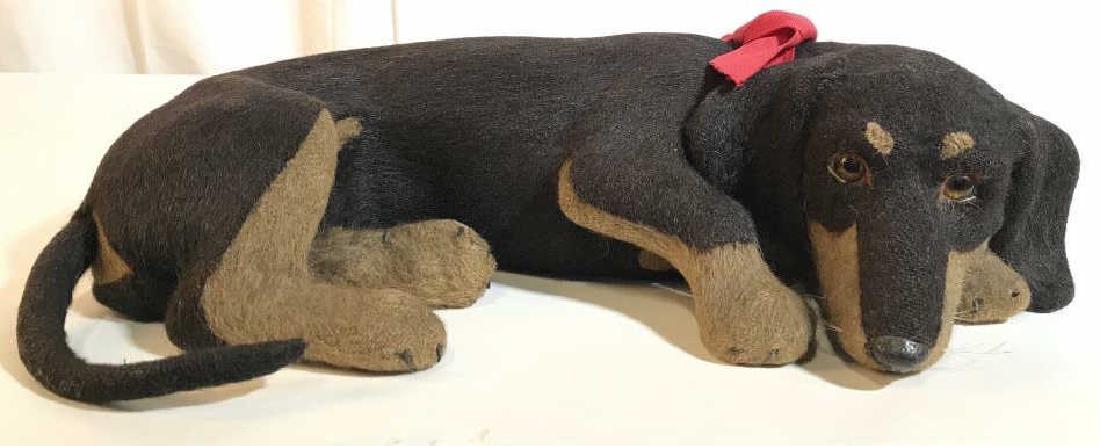 Antique Life Size Dachshund Wood Figural: Antique life size dog dachshund reclining black and tan Figural, Wood base covered in wool and felt, glass eyes. Possibly early Steiff, at one time dogs head removable and dog was filled with candy. O
