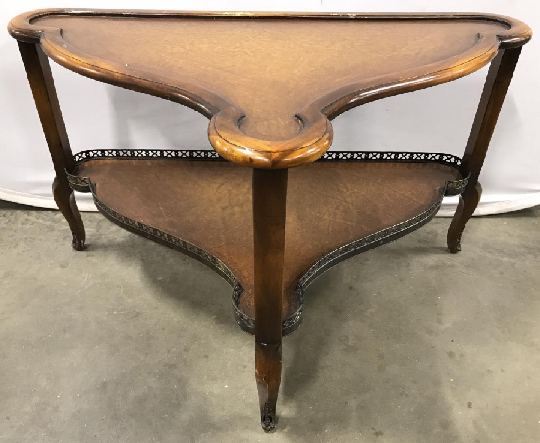 THEODORE ALEXANDER Wooden Corner Table: Tag on piece reads THEODORE ALEXANDER. Piece is wooden. Appears to have leather table top and leather lower level. Corner table, coffee table, Theodore Alexander Table. Piece measures approx 34 inches