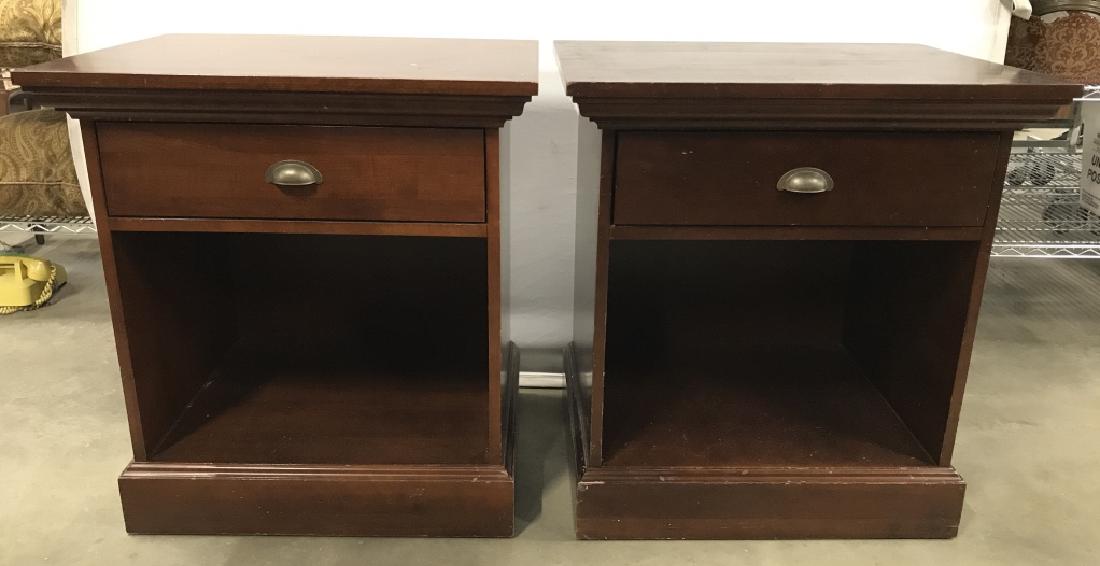 Pair CRATE & BARREL Wooden Bedside Stands: Bedside Stands have Chocolate Mahogany Tone. Each piece contains 1 drawer with silver toned handle. Drawers appear to have hand dovetailing. Interior of drawer has marking which reads CRATE & BARREL. 