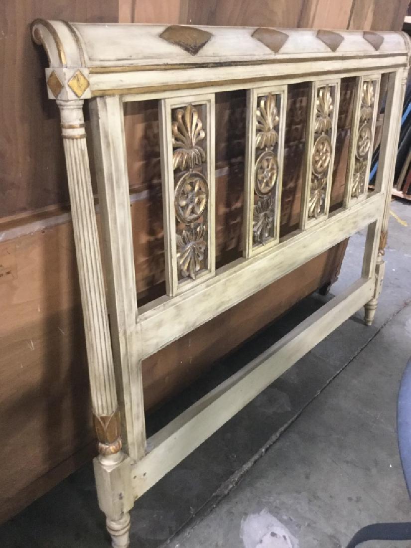 French Provincial Painted Carved Wood Headboard: French Provincial carved wood headboard. Wood is painted in distressed cream and gold tone. Headboard has openwork carved paneling with floral motifs. Measures approx 47 inches in height by 58.5 inche