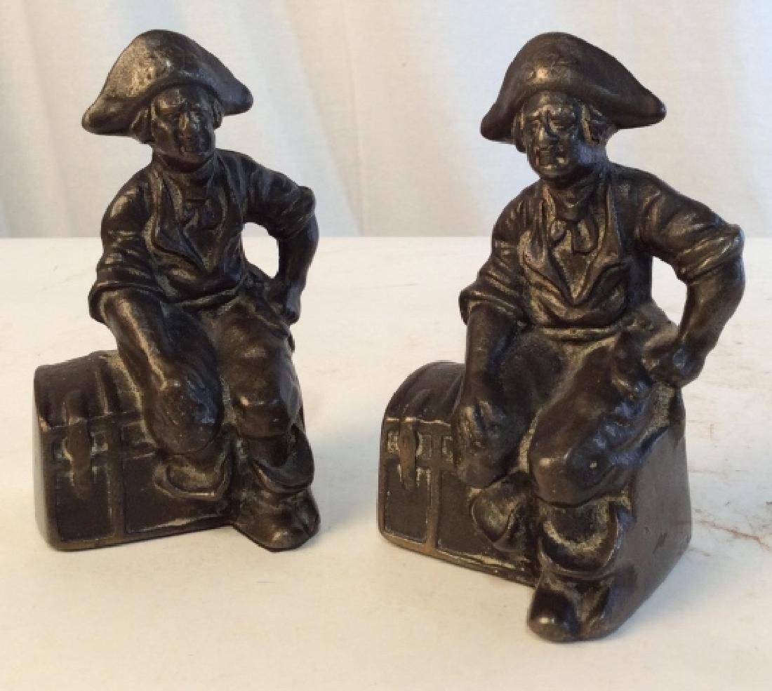 Rustic Cast Iron Pirate Bookends: Pair of old fashioned cast iron pirate and/or pioneers which can be used as Bookends, or door stoppers. Felt, scratch- proofed underside. Each pirate measures at 6 in tall, and 3.2 in wide. Cast iron,
