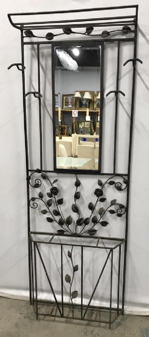 Iron Metal Standing Coat & Cane Tree Rack W Mirror: Iron metal standing tree rack has rose flower & vine details. 4 hooks for hanging and bottom slots for cane/umbrella storage. Beveled mirror center. Measures approx 74 inches in height by 26.5 inches 