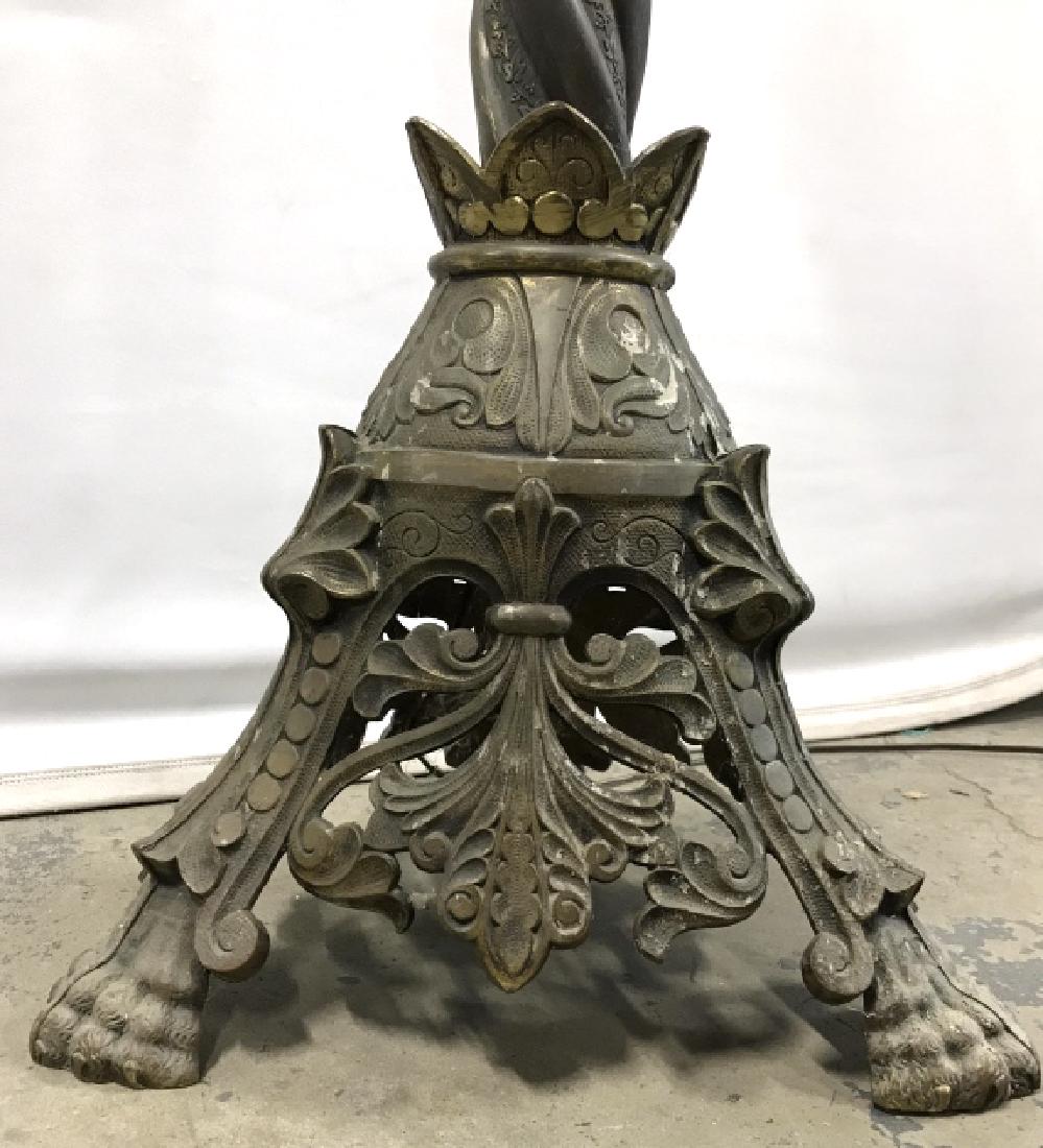 Oversized Gothic Church Altar Floor Lamp: Tall metal, possibly painted brass, electrified floor lamp converted from an oversized Gothic Church altar candle holder. Twisted stem descends into pyramid base with lion paw style feet. Lamp is elec