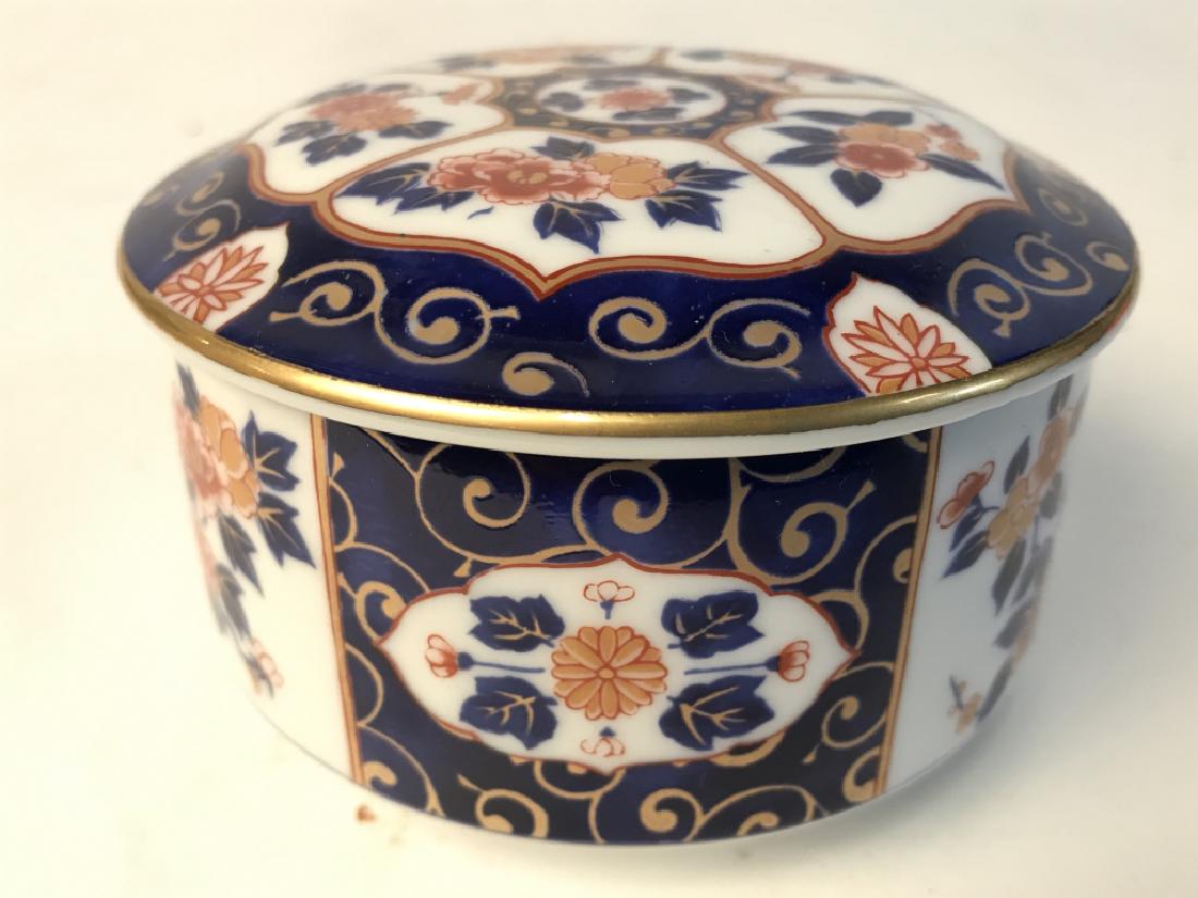 Vintage Porcelain Trinket Box W Lid: Underside of piece contains Asian characters. Piece contains tones of blue, gold, red, orange & white. Measures approx 4 inches wide 2.5 inches tall. Tableware, trinket dish, keepsake dish, vanity acc